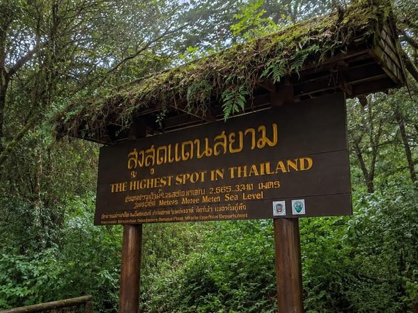 The wooden sign at the summit of Doi Inthanon, the highest spot in Thailand at 2,565 metres