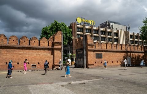 Tha Phae Gate and the brick wall of the old city on an overcast afternoon