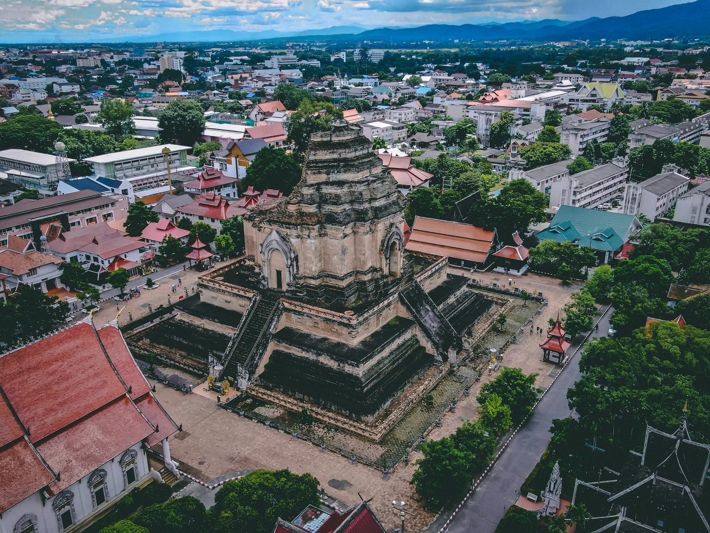 Wat Chedi Luang's ruined brick chedi seen from above, surrounded by the roofs of the old city